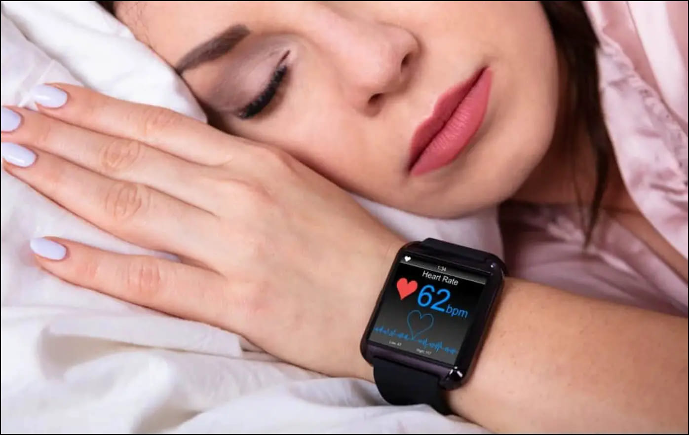 Woman Sleeping with a Smartwatch in her hand