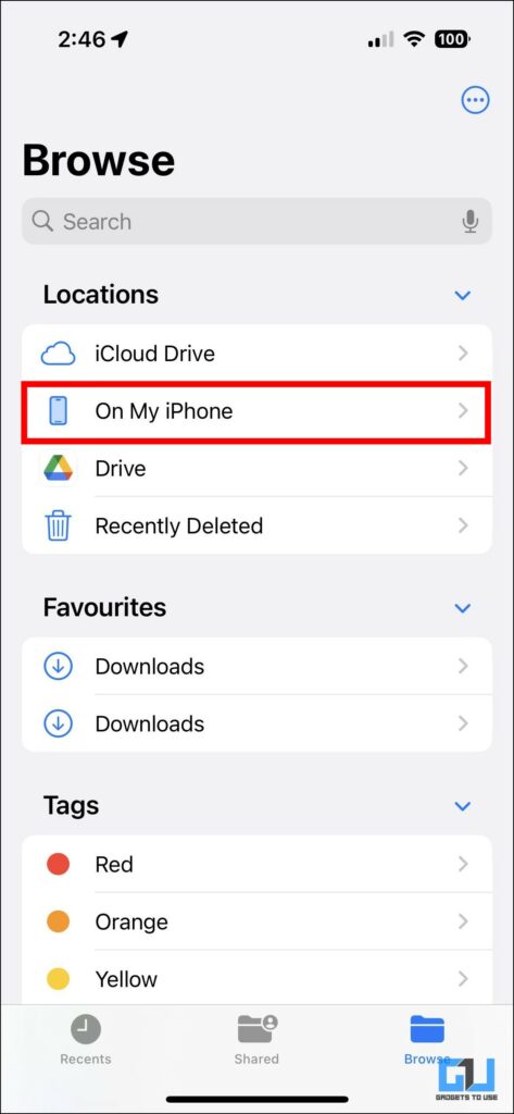 The On My iPhone button is highlighted in red and is listed below iCloud Drive.