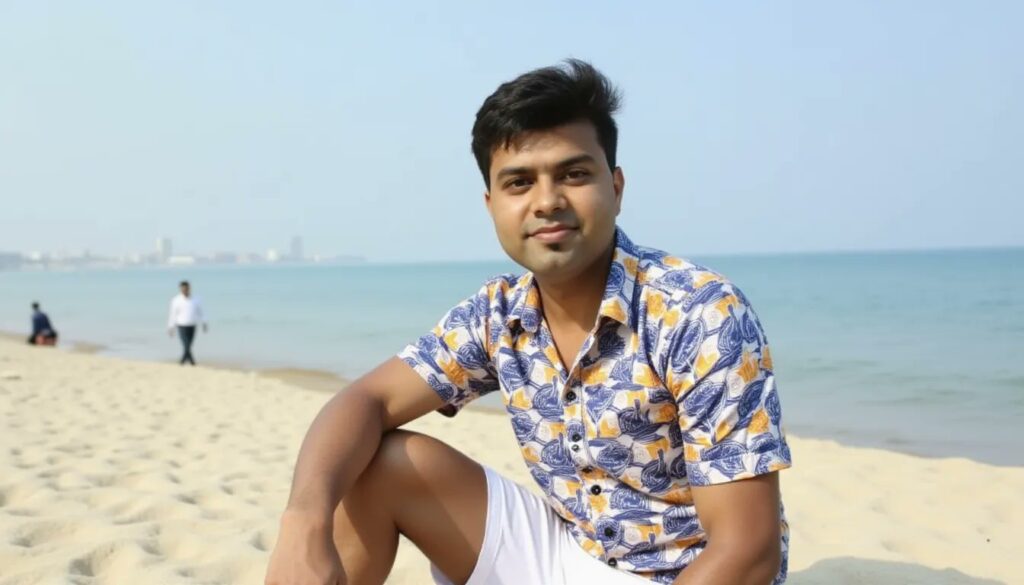 Imagem de Abhishek sentado em uma praia